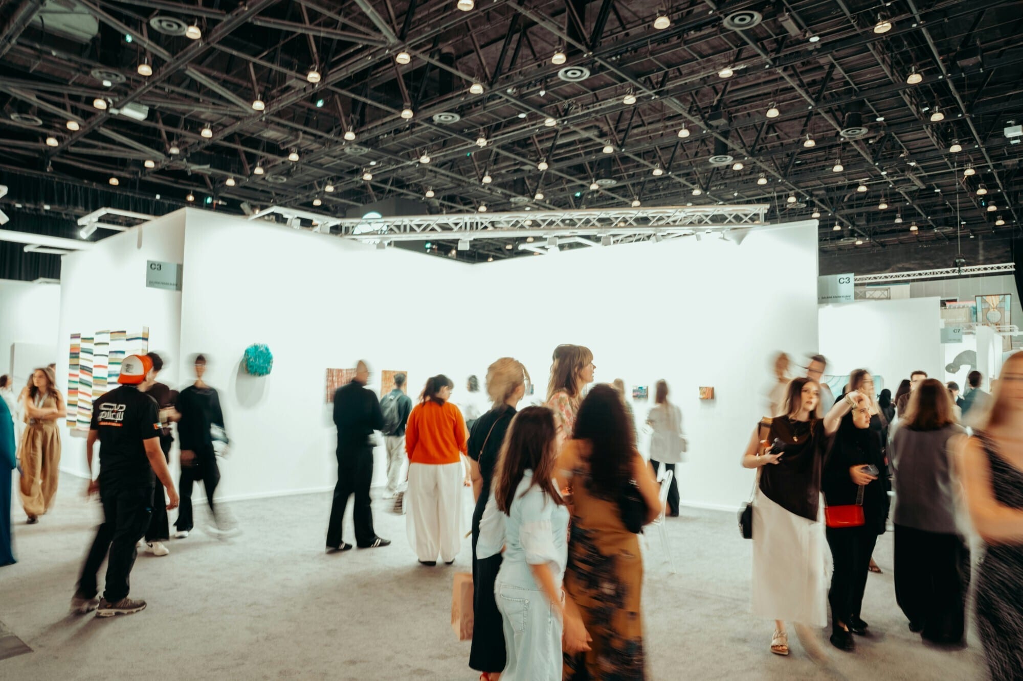 Guests browsing a company event in an exhibition hall